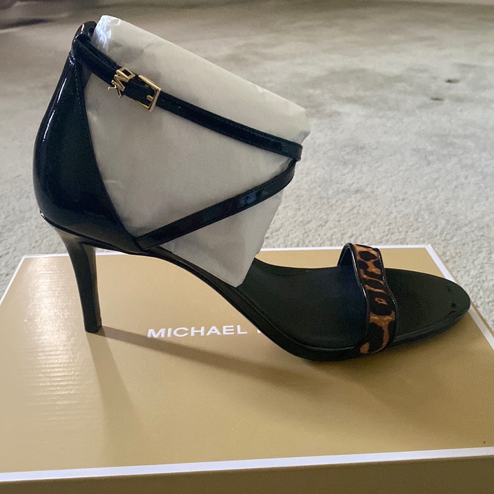 Brand new “Ava Mid Sandal” with black with animal print.The heel is 3 inches.